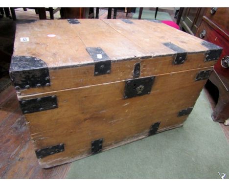 A 19th century stripped and waxed pine trunk, steel banded, complete with carrying handles