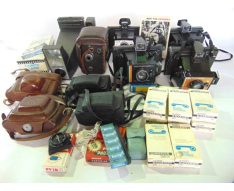 A mixed collection of vintage cameras including polaroid and others together with a quantity of Ilford black and white 126 fi