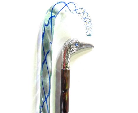 A walking cane, with a hallmarked silver heron head with blue bead eyes together with Nailsea glass walking stick