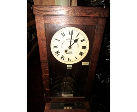A vintage Gledhill-Brook Time Recorders Ltd clocking in and out clock, serial number 71615