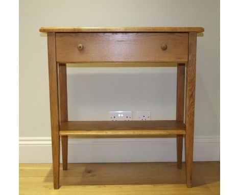 A Wesley Barrell small rustic oak hall/side table with frieze drawer and under shelf raised on square cut supports,  80 cm wi