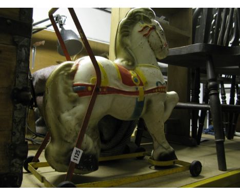 A vintage Mobo child's pressed steel and painted push along toy horse