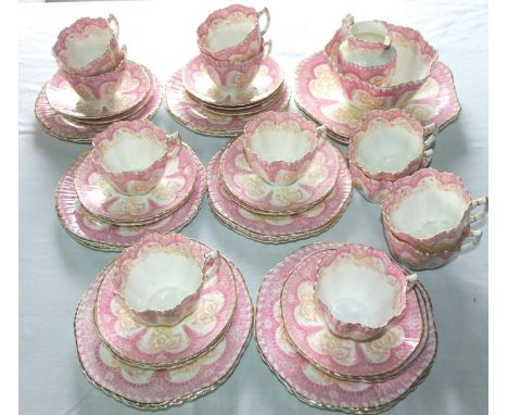A collection of late 19th century Athens pattern tea wares of fluted form with pink printed border decoration comprising a pa