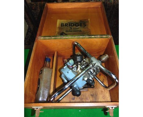 A vintage petrol driven drill by Bridges with three speed mini mota, with chrome casework and travelling case