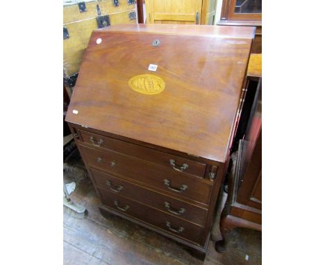 An inlaid Edwardian mahogany bureau with simply fitted interior with a deep shell inlaid fall flap over four frieze drawers o