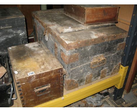 A vintage stained pine and steel banded tool chest with hinged lid containing a quantity of hand tools, mainly carpentry rela