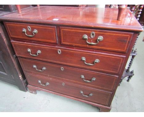 A Georgian mahogany chest of three long and two short drawers with chequered string inlay and brass swan necked handles on br