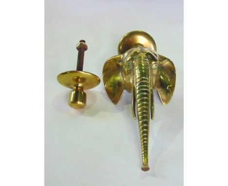 An unusual cast brass door knocker in the form of an elephants head with long trunk