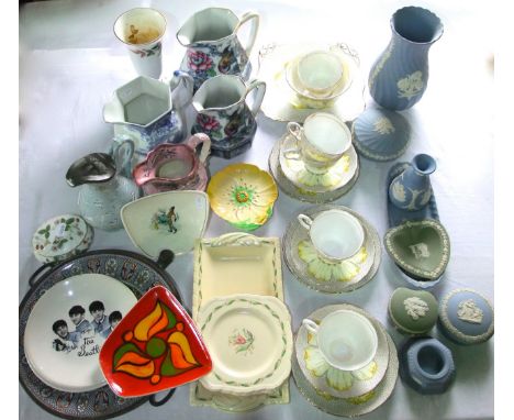 A collection of Tuscan art deco tea wares with yellow stylised floral decoration comprising cake plate, sugar bowl, five cups