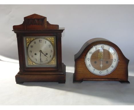 An oak cased mantle clock with striking movement, together with a further bracket clock with square dial and striking movemen