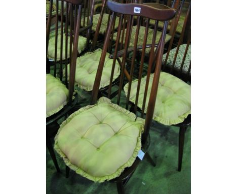 A set of six (4 &2) Ercol stick back dining chairs in a medium brown colour