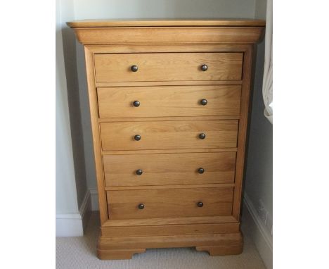 A Feather & Black Grandchester collection chest of five drawers plus a cushion moulded drawer raised on bracket supports 90cm
