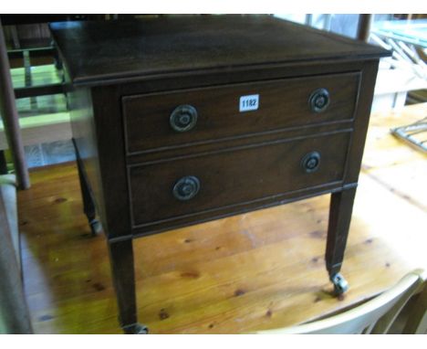 A 19th century mahogany commode, later converted to a low chest with frieze drawer raised on square cut supports with brass c