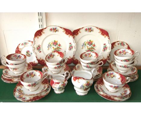 A collection of Paragon Rockingham pattern tea wares comprising a pair of cake plates, two milk jugs, eleven cups, thirteen s