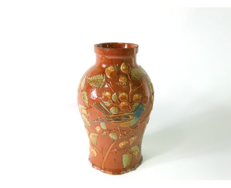 A large early 20th century Lauder West Country pottery vase with relief moulded fruiting bough and bird decoration in tones o