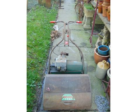 A vintage Webb cylinder petrol lawn mower with Tecumseh 4hp engine, 24 inch cut, roller and grass collection box