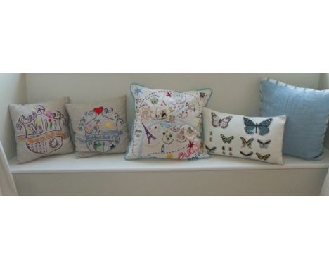 Three French embroidered cushions together with a further Iosis cushion with butterfly detail and a further designers guild c