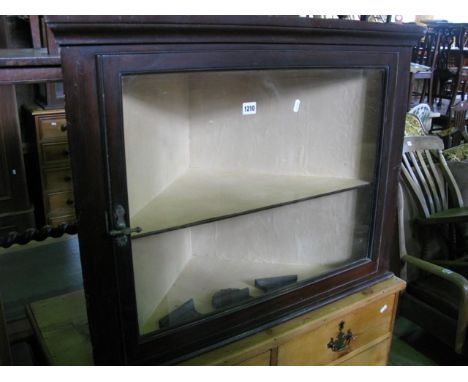 A late Victorian /Edwardian mahogany hanging corner display cabinet enclosed by a rectangular glazed panelled door with fixed