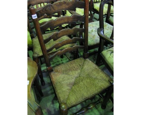 A pair of Georgian style ladder-back dining chairs with rush seats on turned supports and rails