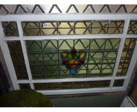 A reclaimed early 20th century painted pine framed casement window with leaded light and central stained glass panels, bulls 
