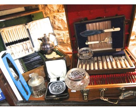 An extensive collection of plated wares including a substantial rectangular tray with engraved decoration, two canteens conta