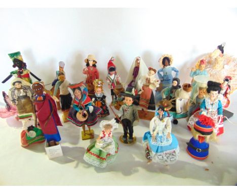 A large quantity (2 boxes) of vintage timber and composition dolls in costumes from around the world, various size and type