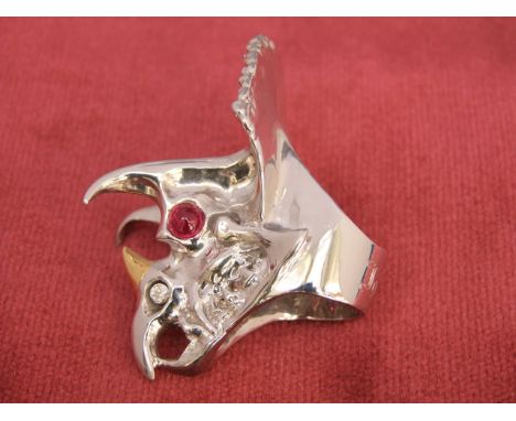 An 18ct white and yellow gold diamond and cabochon ruby dragon, ring size R by repute a gift from Iggy-Pop, approx 97g