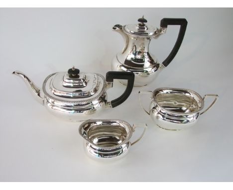 A silver four piece tea set of plain bellied boat shape form by E.S & Co, Sheffield 1950 to include tea pot, hot water jug, m