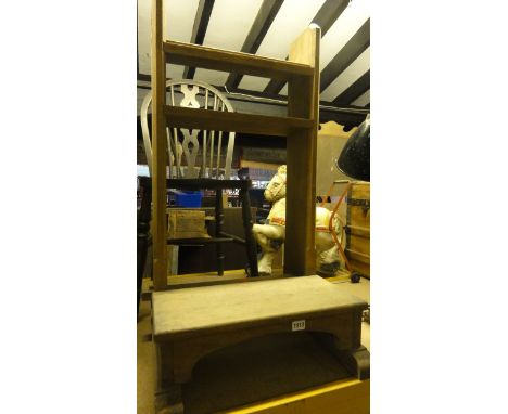 A light oak ecclesiastical prayer stand/kneeler with carved gothic tracery and chamfered frame