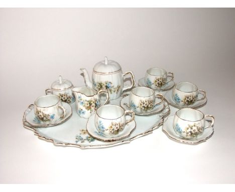 A box of early 20th century Carlsbad Austrian Victoria Caberet set comprising two handled tray, tea pot, milk jug, covered su