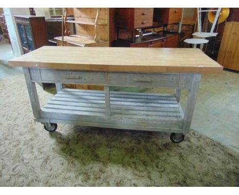 A substantial contemporary kitchen portable work station, the light beechwood top of rectangular form raised on a painted pin
