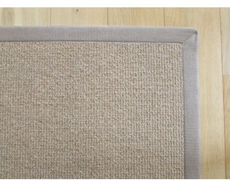 A good quality carpet square in pale oatmeal with over sewn borders, 167cm x 220cm