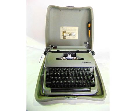 An Olympia manual typewriter model SM3 in travelling case in almost unused condition