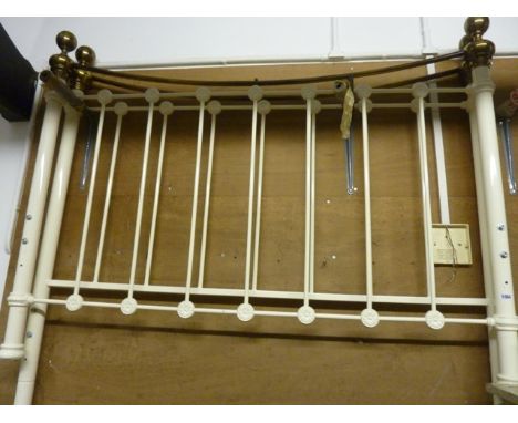 A Victorian style brass and cream painted iron bedstead with flower head medallion to rails beneath ball finials