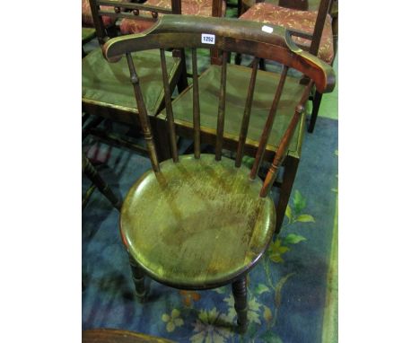 A set of four Swedish stained beechwood stick back kitchen chairs with circular seats raised on turned legs with bobbin detai