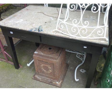 A vintage painted industrial steel framed work table of rectangular form with two frieze drawers raised on four square tapere