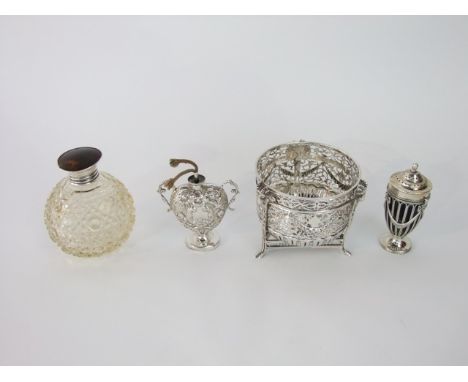 A collection of Victorian and later silver items to include an open work bowl raised on three feet with ramshead mask decorat