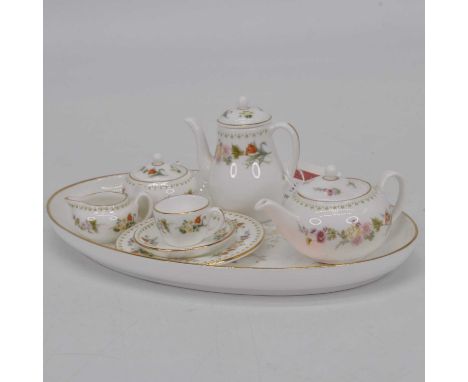 A miniature Wedgwood floral decorated bachelor's tea &amp; coffee service, on a Royal Doulton Mystic Dawn trayThey all appear