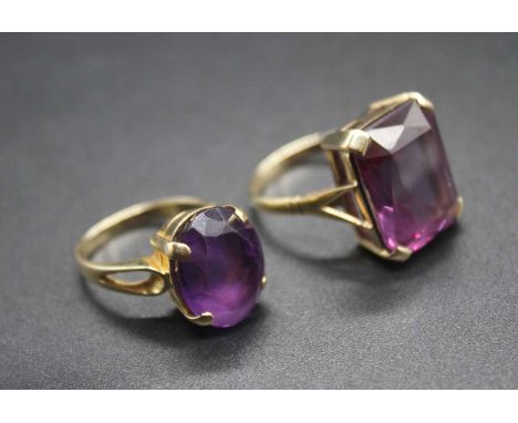 A continental yellow metal and oval cut amethyst set dress ring, stamped 585, 6.1g, size K; together with a modern 9ct gold a