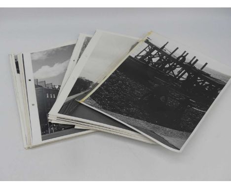 A collection of black and white printed photographs, to include architectural and topographical views