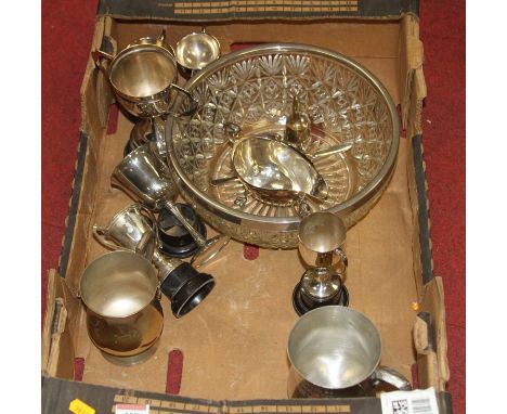 A collection of mixed metal ware to include a pewter tankard, a silver plated helmet shaped sauce boat, and a trophy cup etc