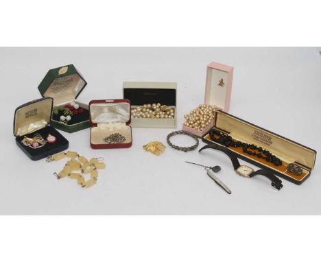 A collection of miscellaneous items to include a faux pearl single string necklace, a faux jet necklace, ladies wristwatch et