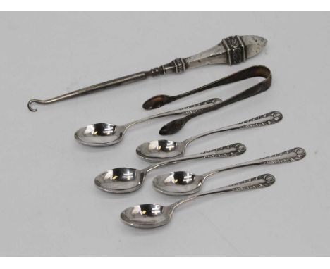 A set of five George V silver teaspoons, each having an embossed stem, together with a pair of silver sugar tongs and a silve