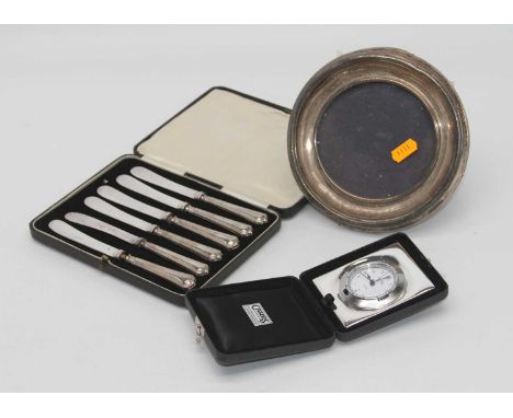 A modern Cars silver clad easel travel clock, having a quartz movement in leather case, together with an Edwardian silver cla