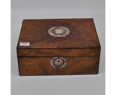 A Victorian walnut and mother of pearl inlaid workbox of rectangular form hinged lid opening to reveal a blue silk lined fitt