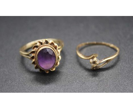 A 9ct gold diamond point crossover ring; together with a 9ct gold and oval cut amethyst set dress ring, gross weight 3.5g (2)