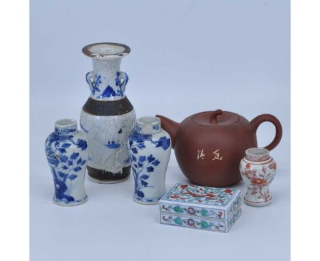 A collection of Chinese ceramics to include a Yixing red ware teapot, a pair of blue &amp; white baluster vases, and a Nankin