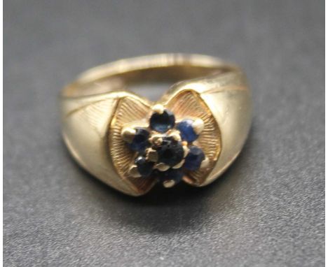 A 9ct gold and sapphire set flower head cluster ring, 4.3g, size L