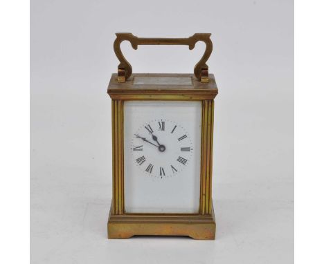 An early 20th century brass cased carriage clock, the enamel dial showing Roman numerals, having platform escapement, height 