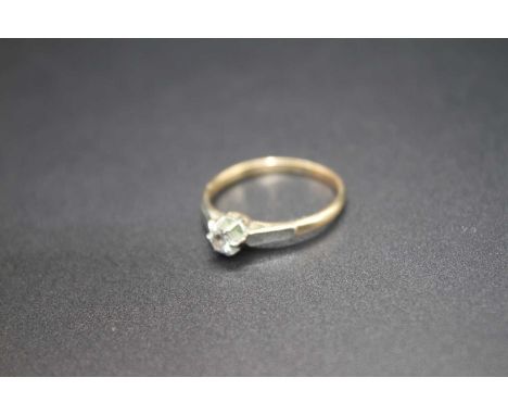 A 9ct gold and platinum diamond solitaire ring, the six claw set round cut diamond weighing approx. 0.13 ct, 2g, size P